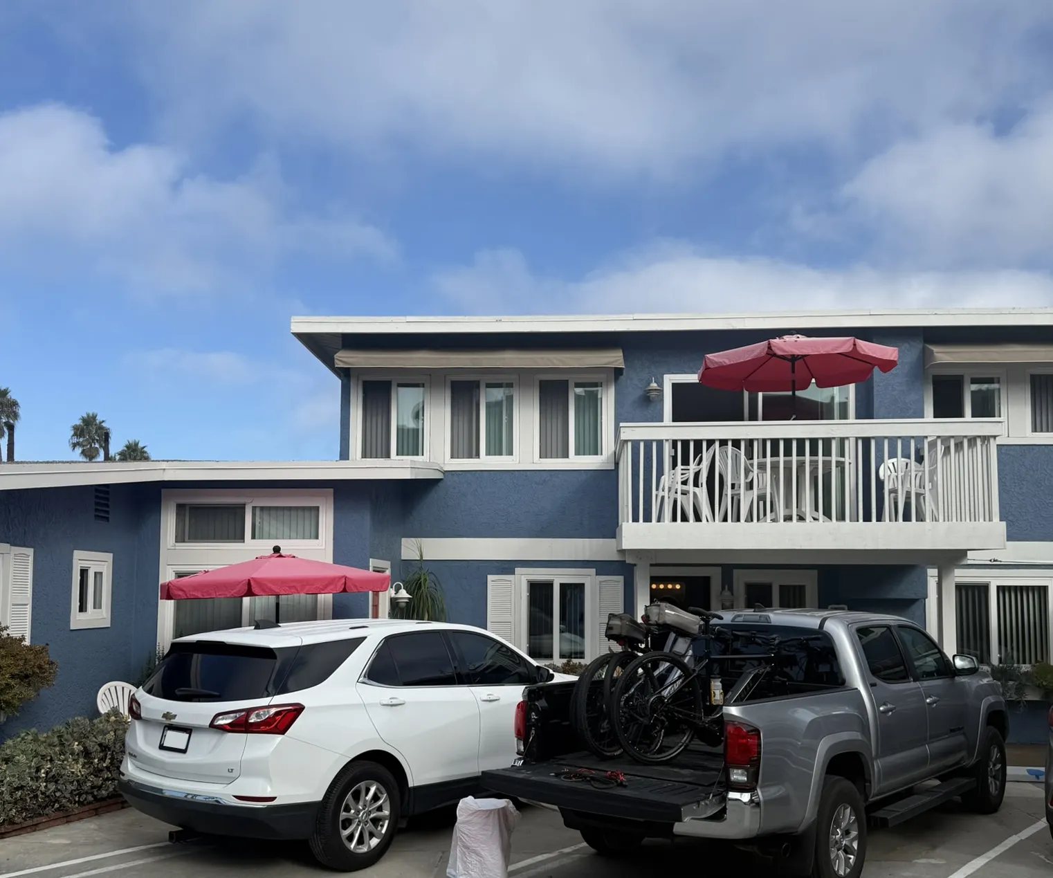 Two-story Blue Whale building and parking area
